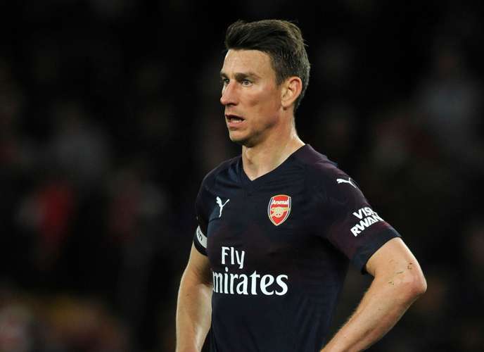 FILE - In this Wednesday, April 24, 2019 file photo, Arsenal's Laurent Koscielny looks on during their English Premier League soccer match againsy Wolverhampton Wanderers at the Molineux Stadium in Wolverhampton, England. Arsenal says captain Laurent Koscielny has refused to travel with the team for its preseason tour to the United States, it was announced Thursday, July 11. The Premier League club released a statement saying it was “very disappointed by Laurent’s actions, which are against our clear instructions.” Arsenal says it was working to resolve the matter. (AP Photo/Rui Vieira, file)